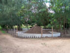 Compost heap build with small wall to avoid spillage